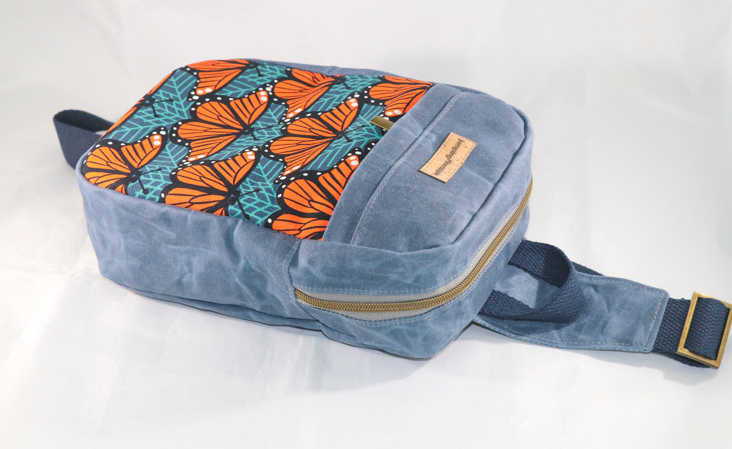 sling backpack laying flat