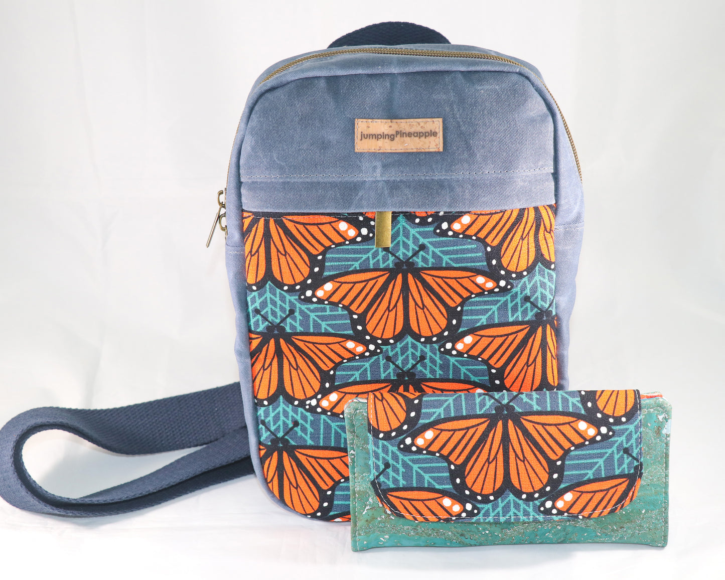 front view of sling backpack with coordinating wallet