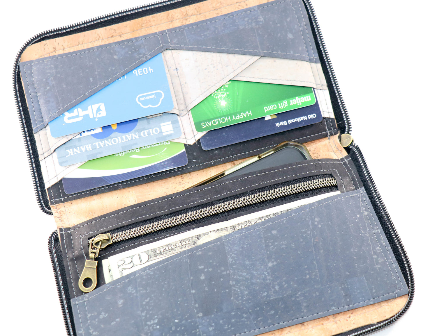 purple clutch wallet, different wallet but showing the inside filled with cards, cash and a phone