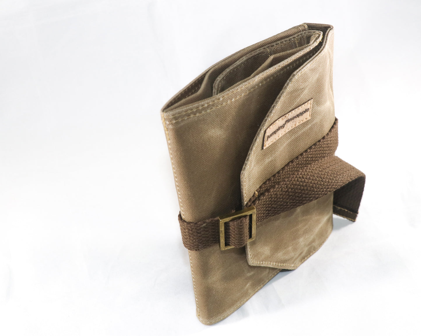tan waxed canvas artist roll, front view standing up on edge