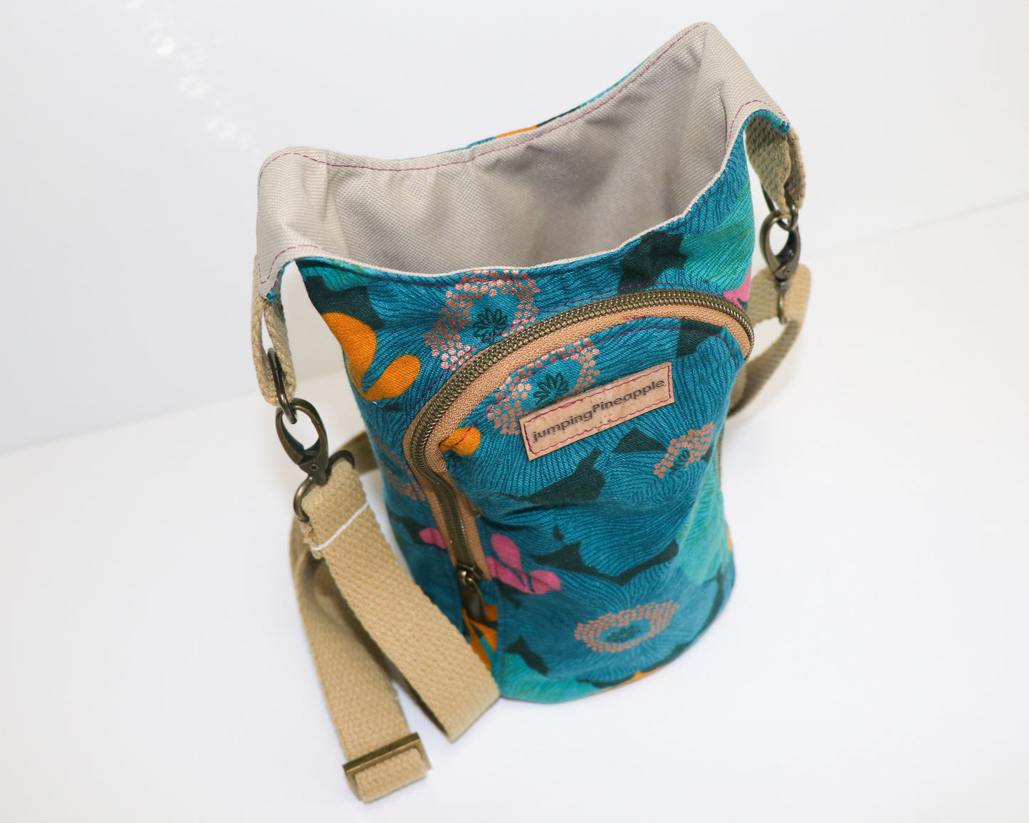 teal and blue floral water bottle sling, top view