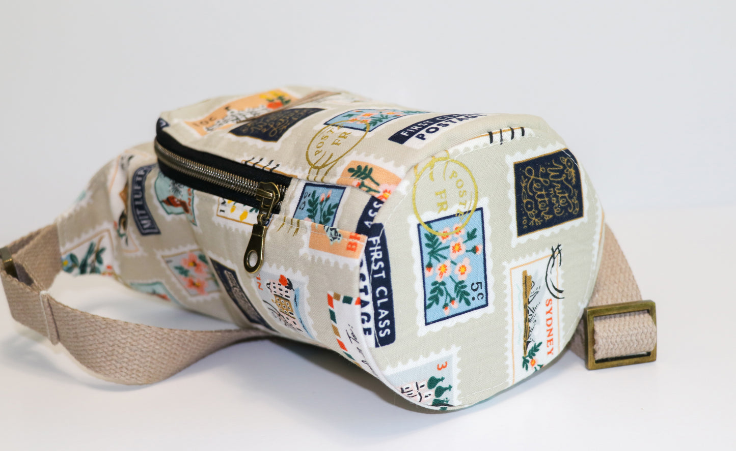 postage stamps print water bottle sling, view of base