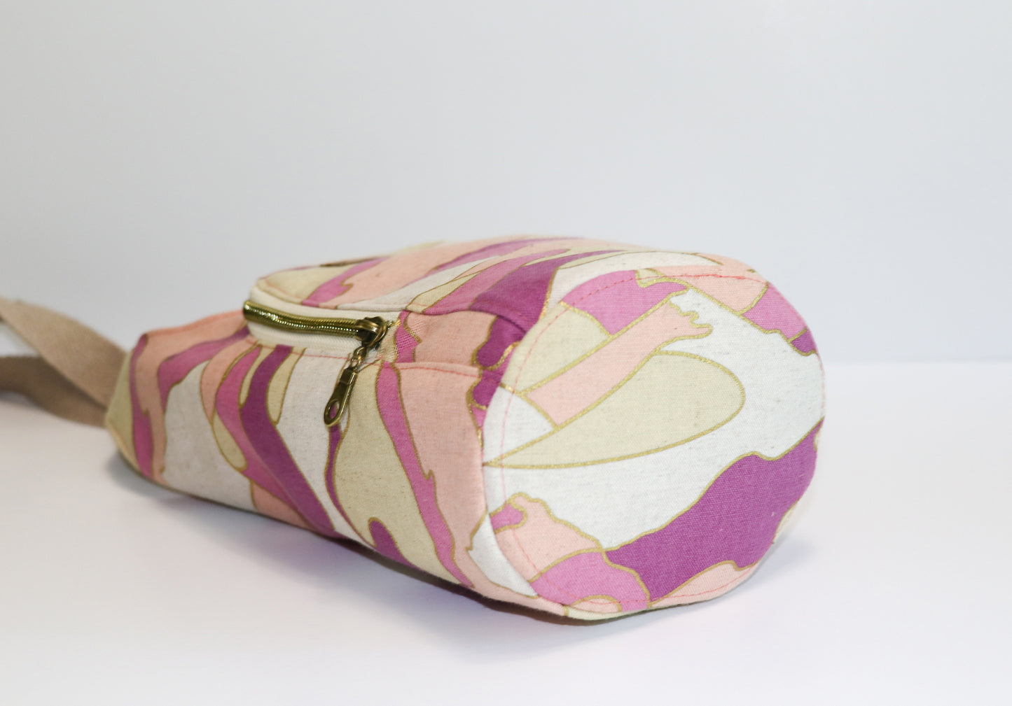 magenta and coral print water bottle sling, view of base