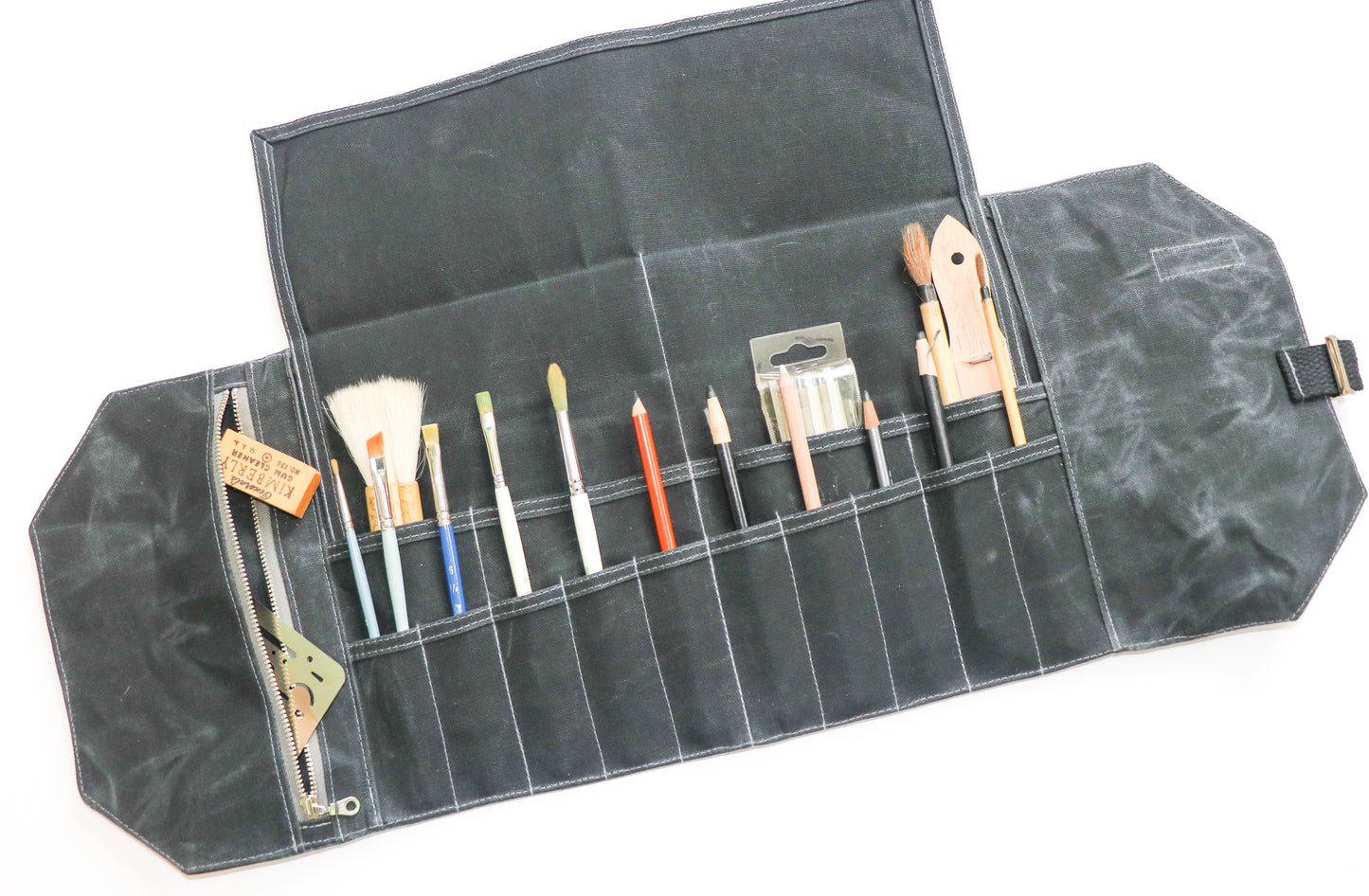 black artist roll, inside view with art supplies