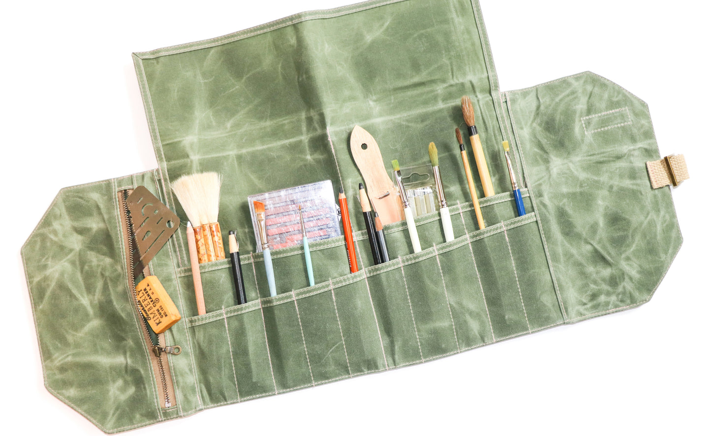 olive waxed canvas artist roll, inside view with art supplies