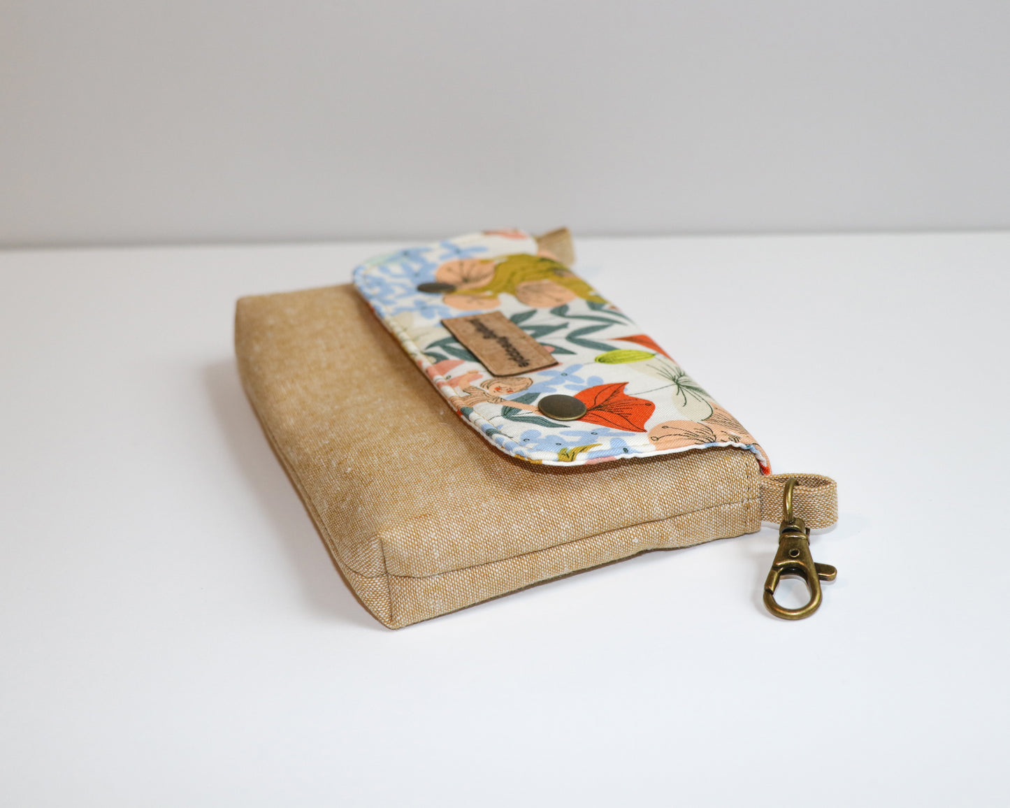 floral and kids belt loop pouch, side view laying flat