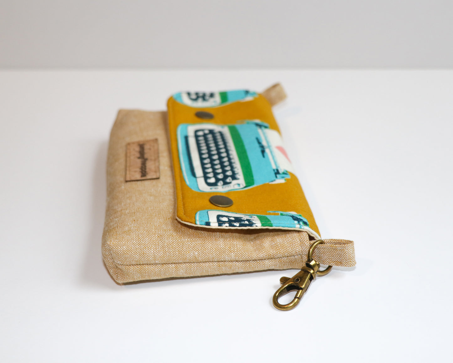 mustard typewriter pouch, side view laying flat