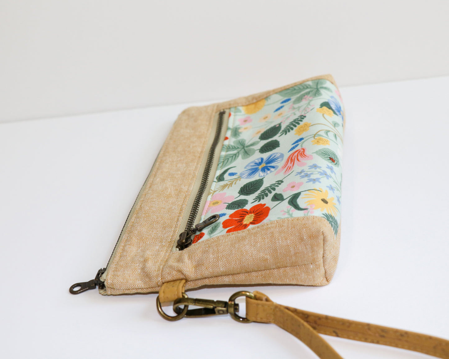 mint floral and linen wristlet, laying flat