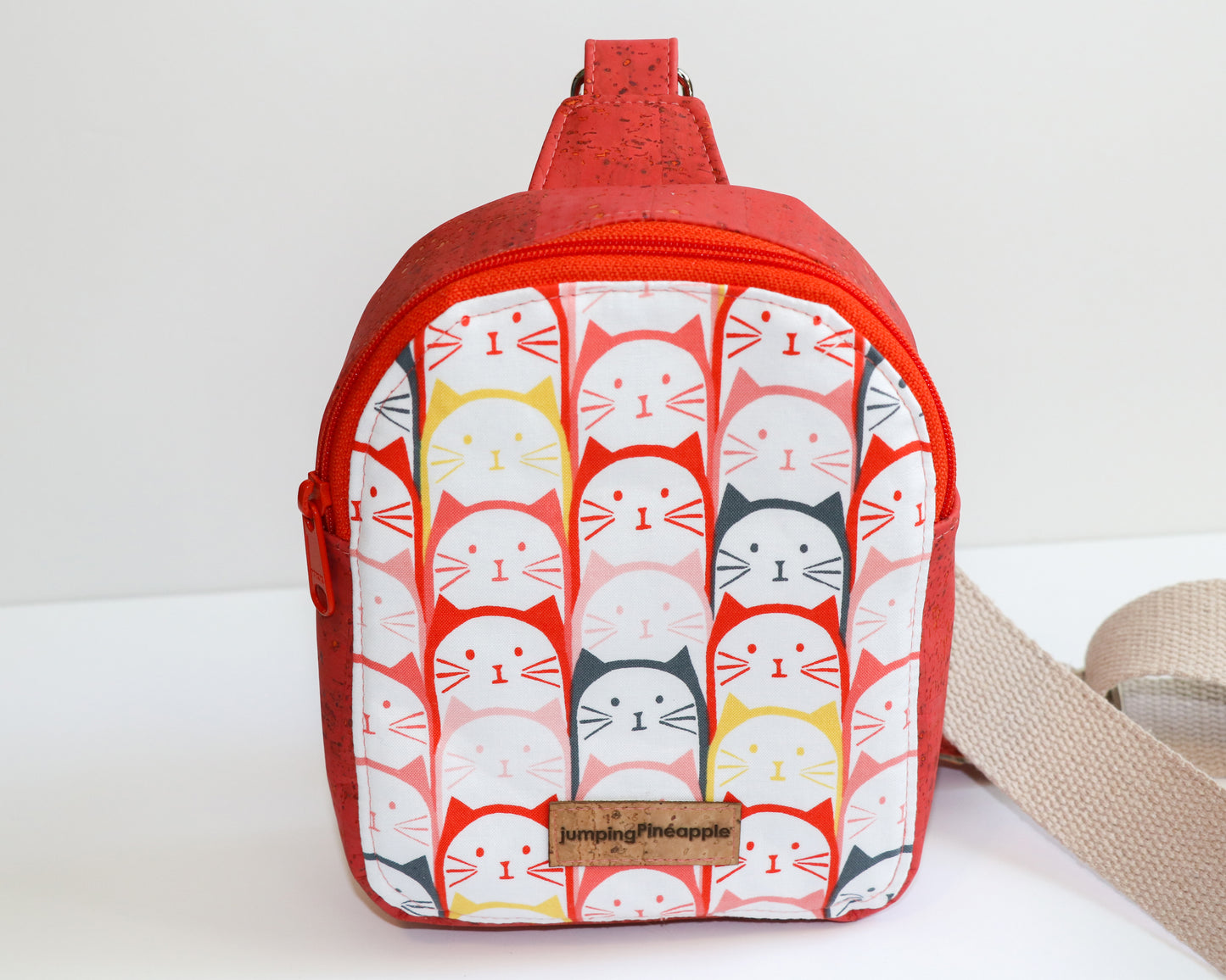 coral cats mini backpack sling, front view