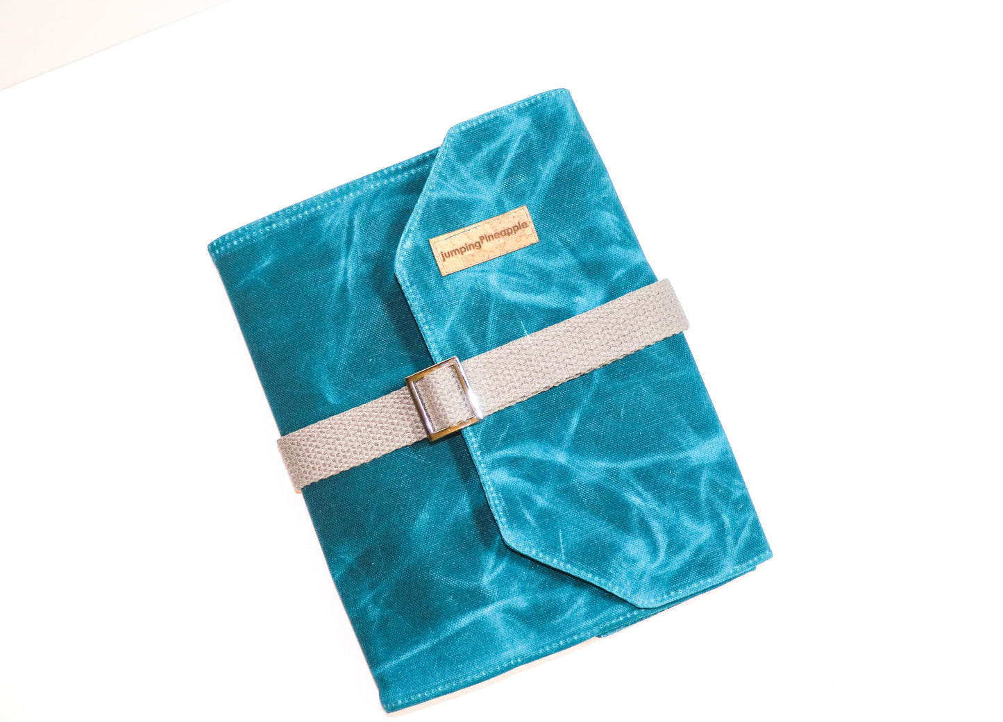 large teal artist roll, front view with grey strap