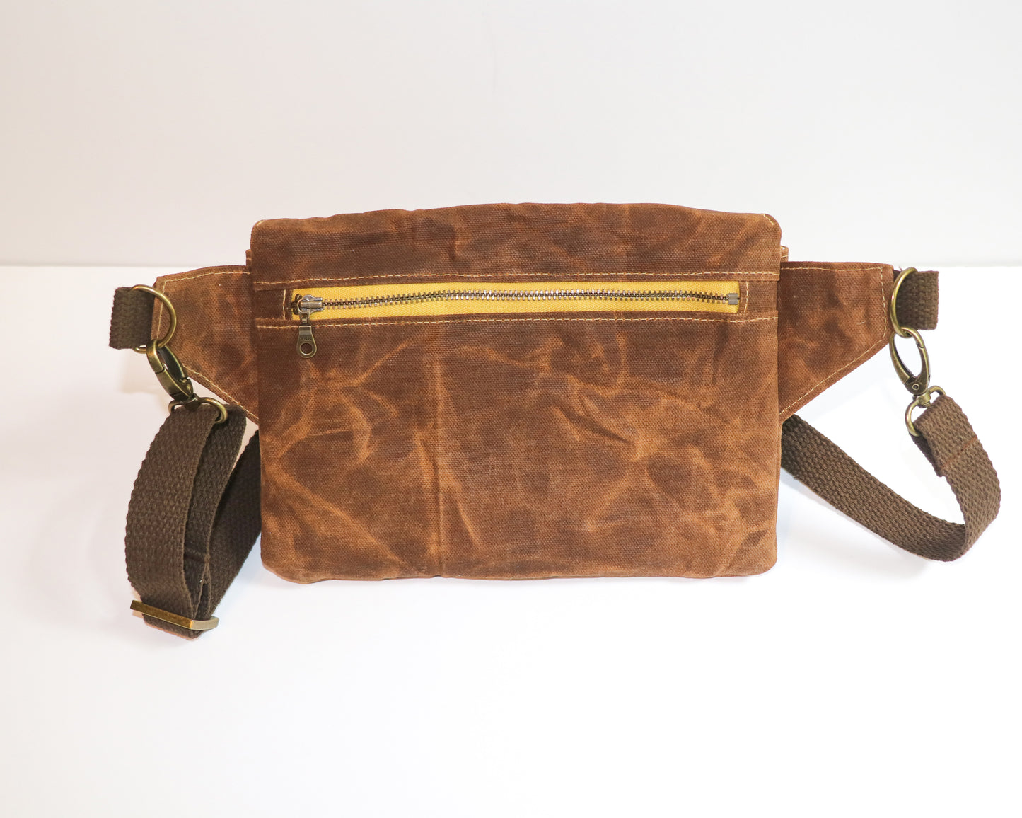 brown waxed canvas belt bag, back view