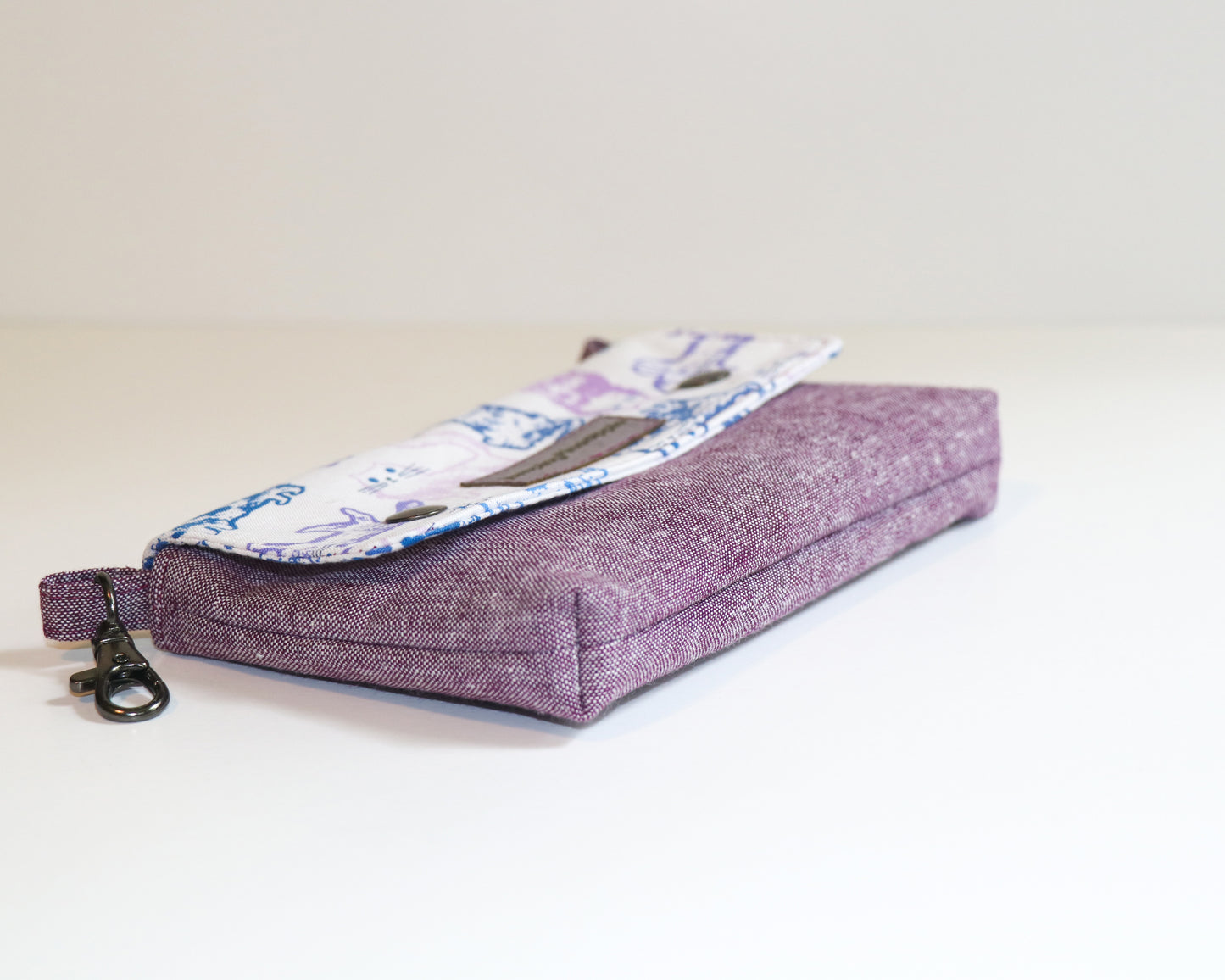 purple cats belt loop pouch, laying on side