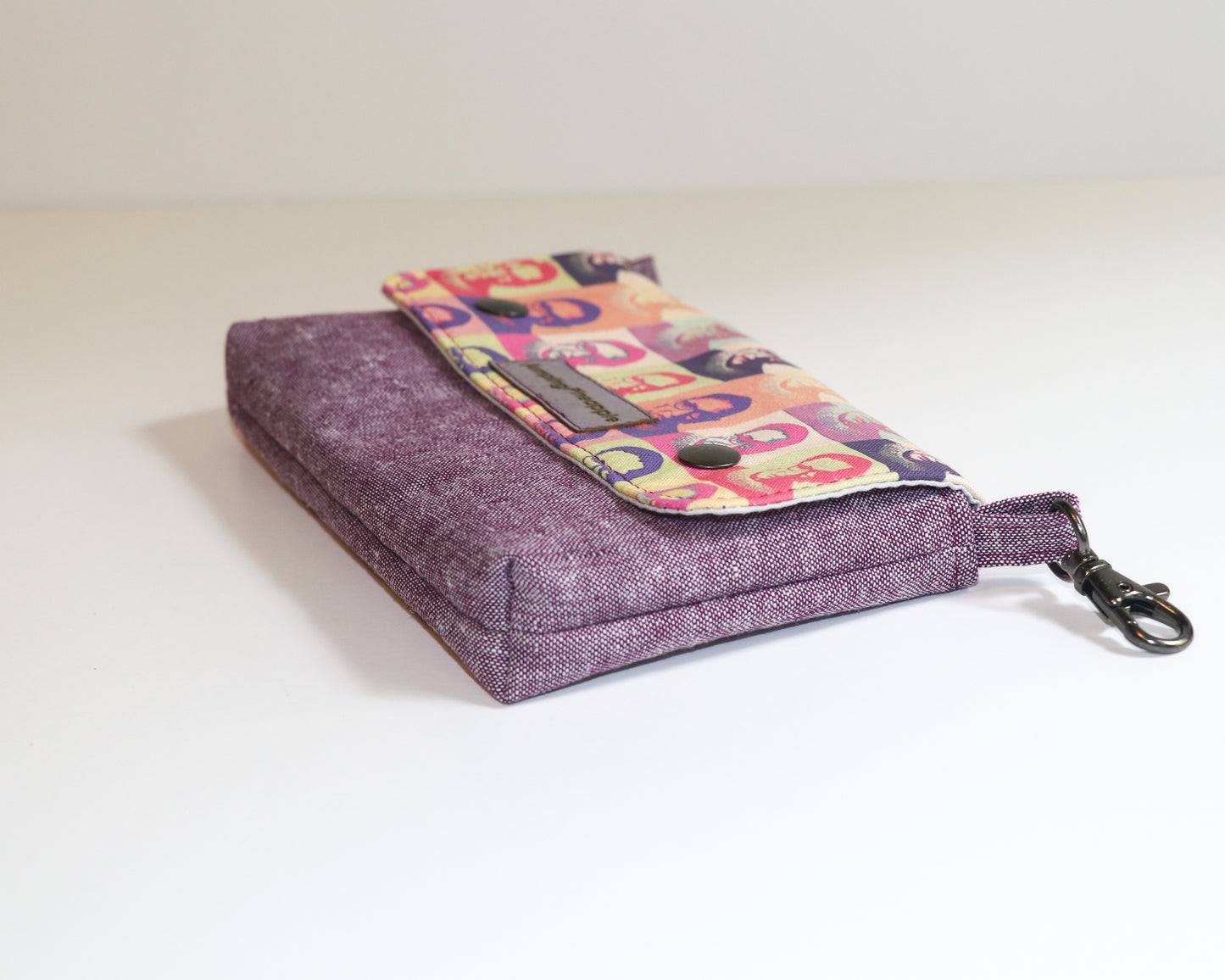 purple RBG belt loop pouch, laying on side