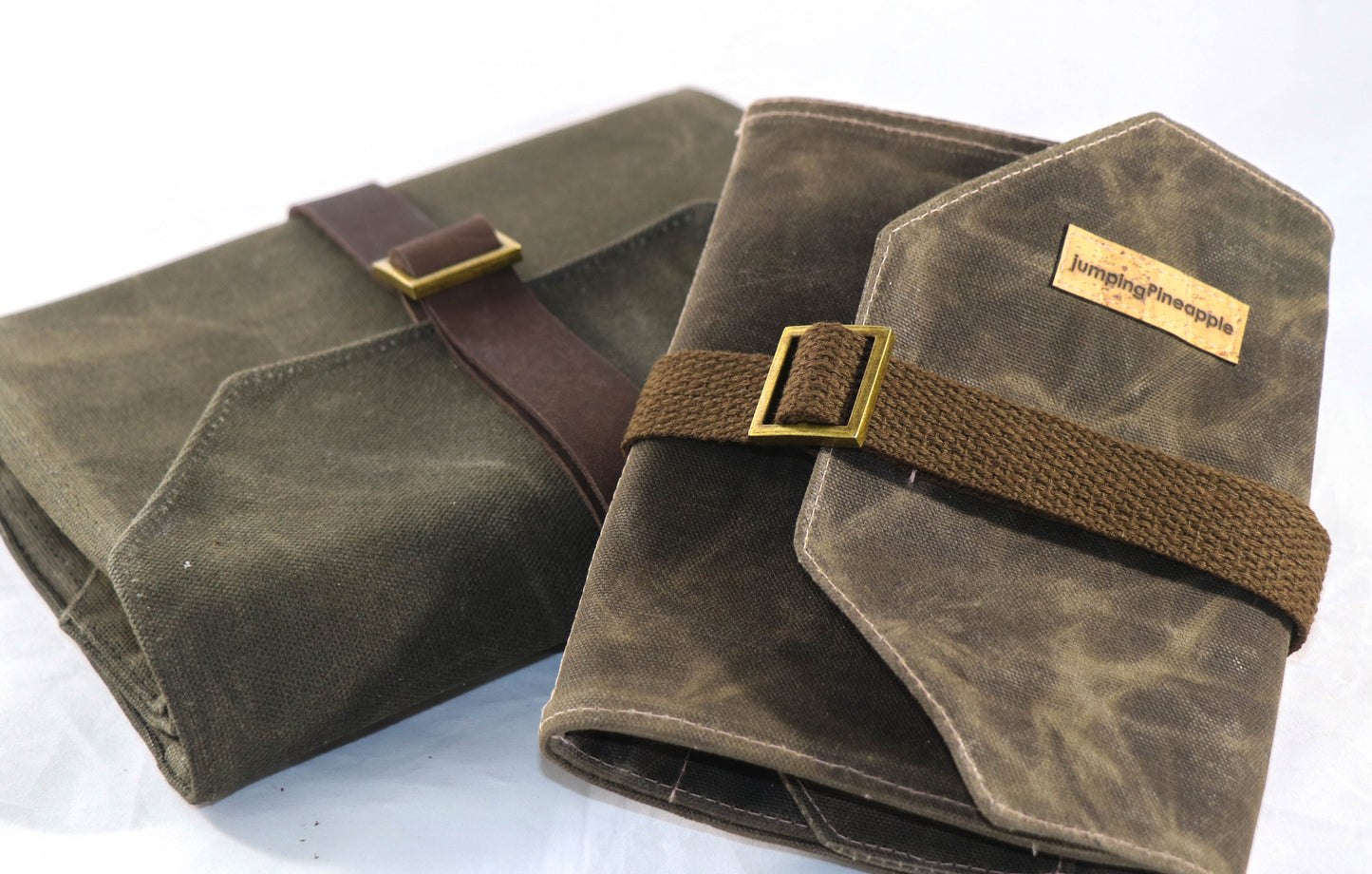 dark brown artist roll with leather strap and cotton strap shown
