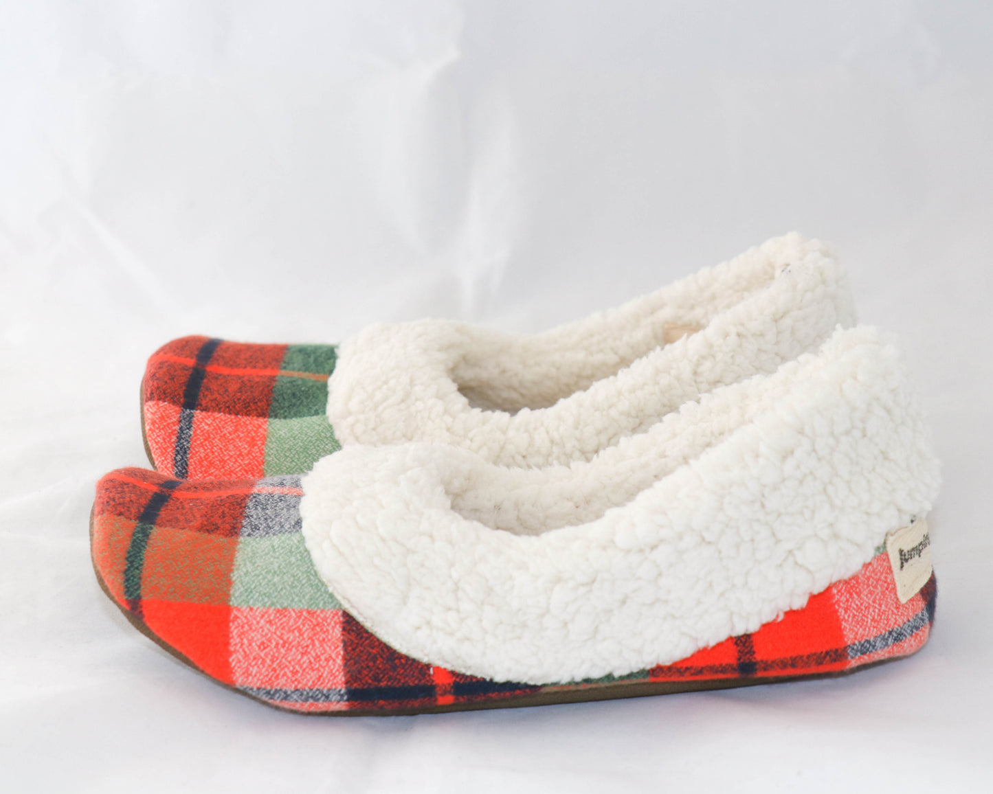orange and green flannel slippers with cream sherpa inside