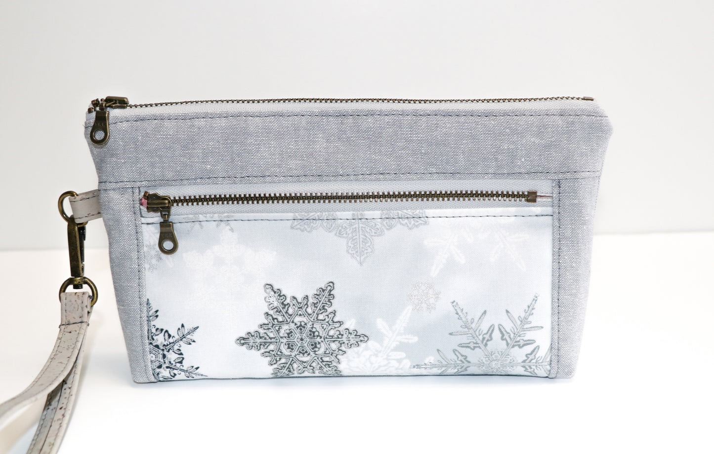 grey and metallic snowflake print wristlet
