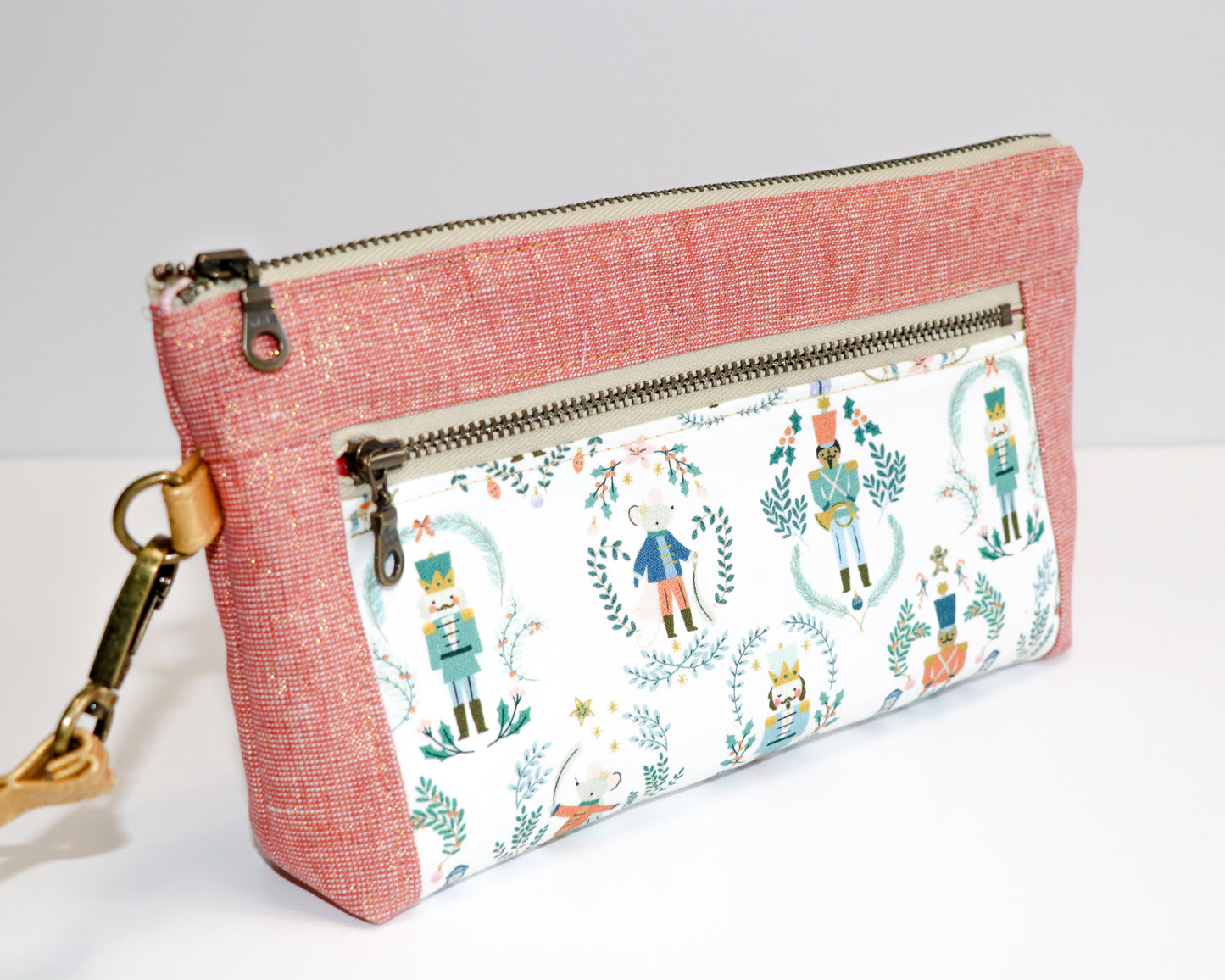 Nutcracker print and rose metallic linen wristlet