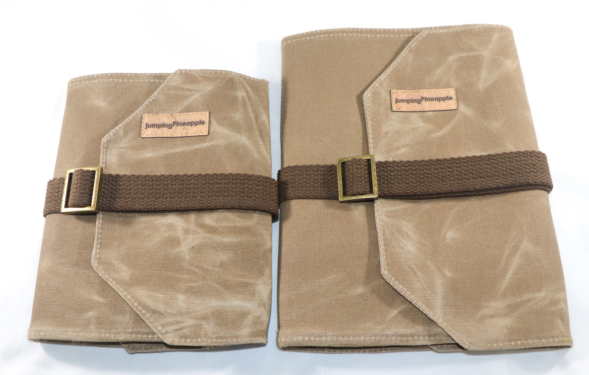 tan waxed canvas artist roll, front view of regular size beside large size