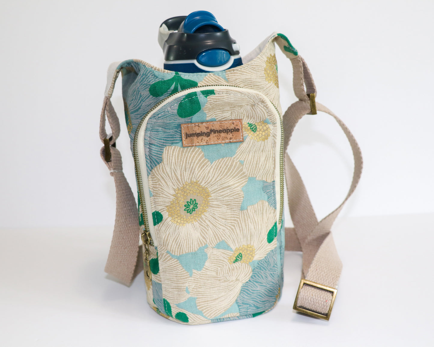 light blue floral water bottle sling, front view with water bottle