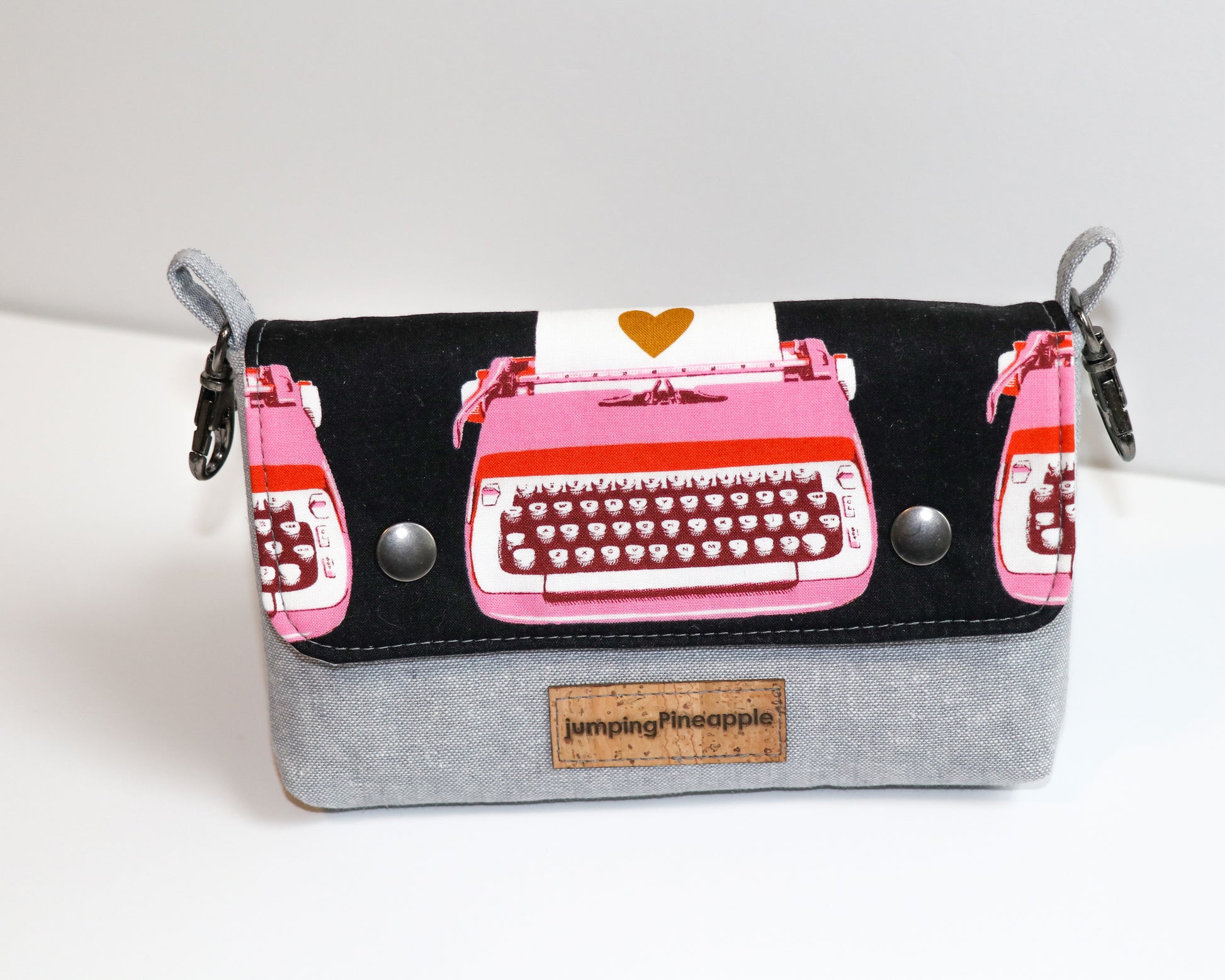 black and pink typewriter belt loop pouch, front view