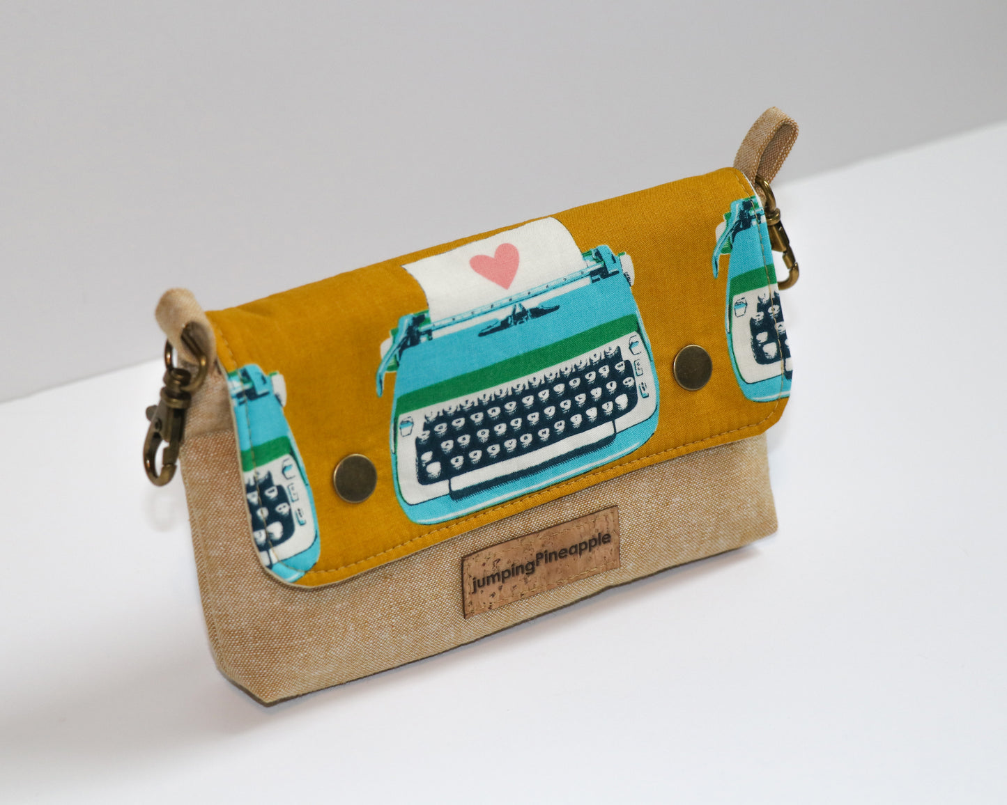mustard typewriter pouch, angled front view