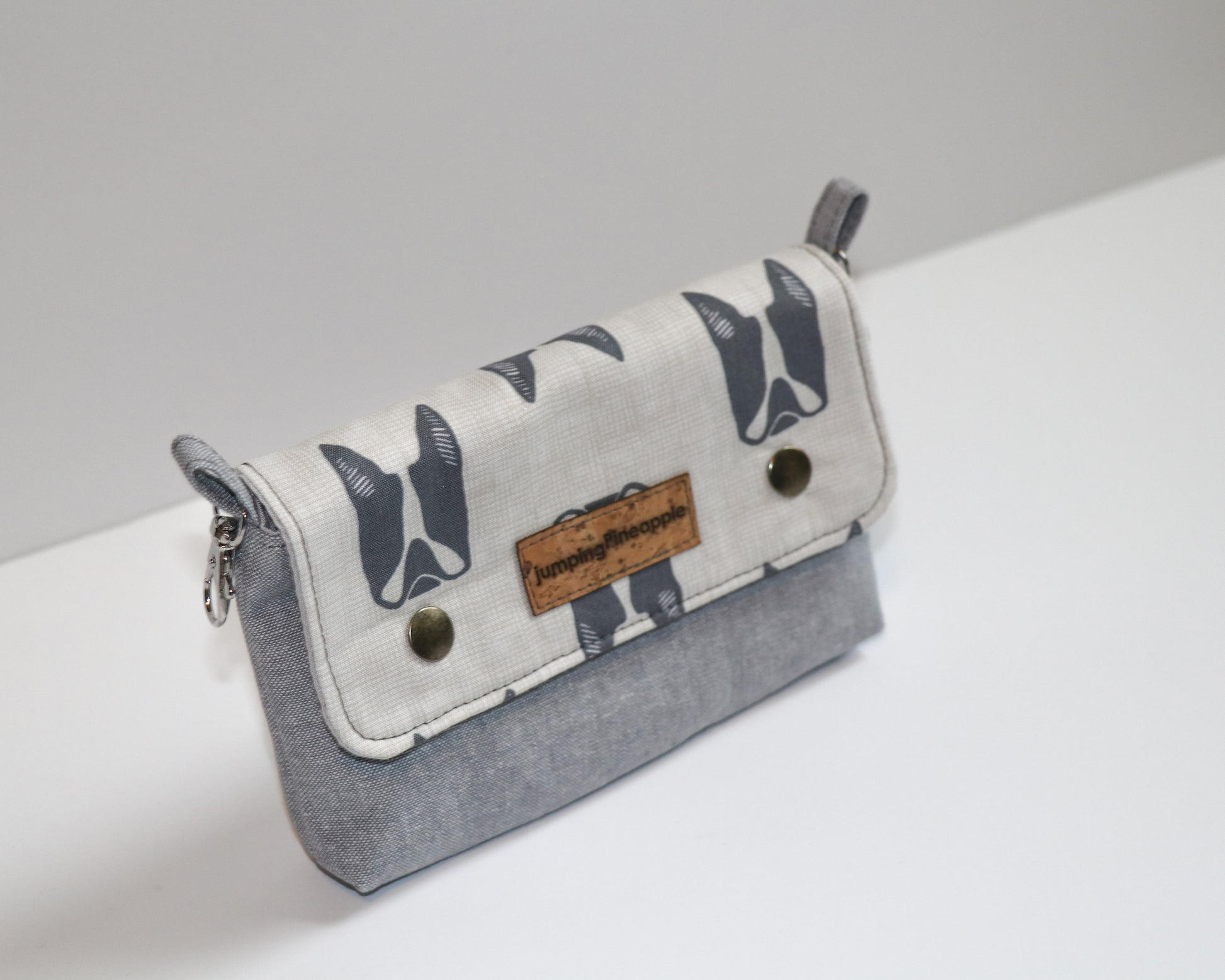 belt loop pouch with dark grey dogs, angled view