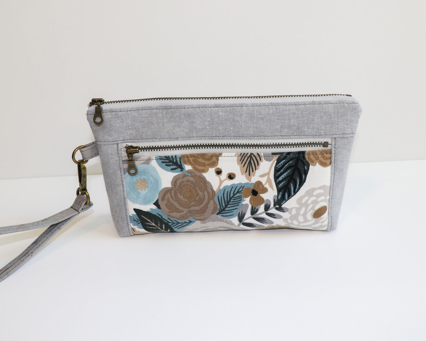 grey and blue floral wristlet, front view