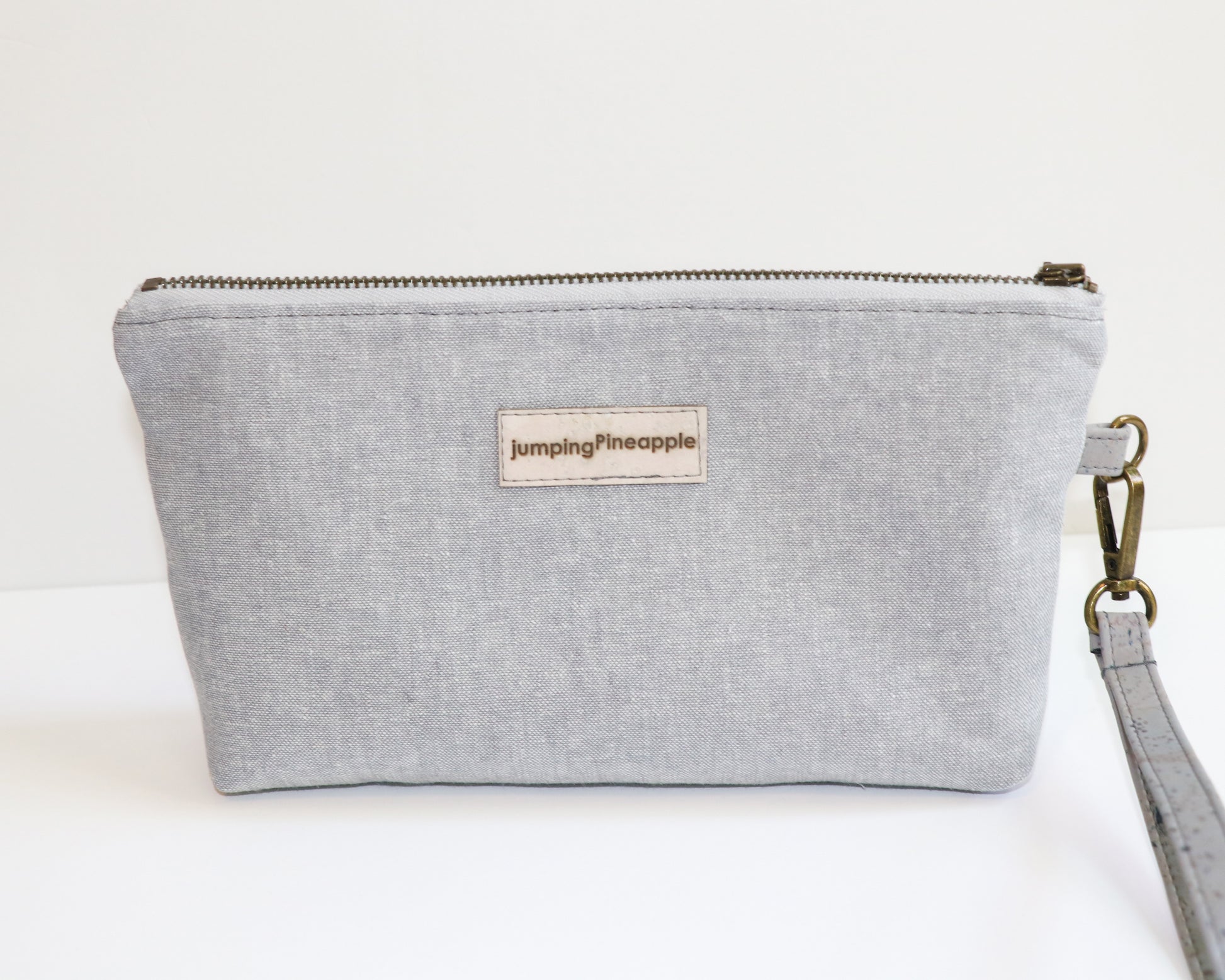grey and blue floral wristlet, back view