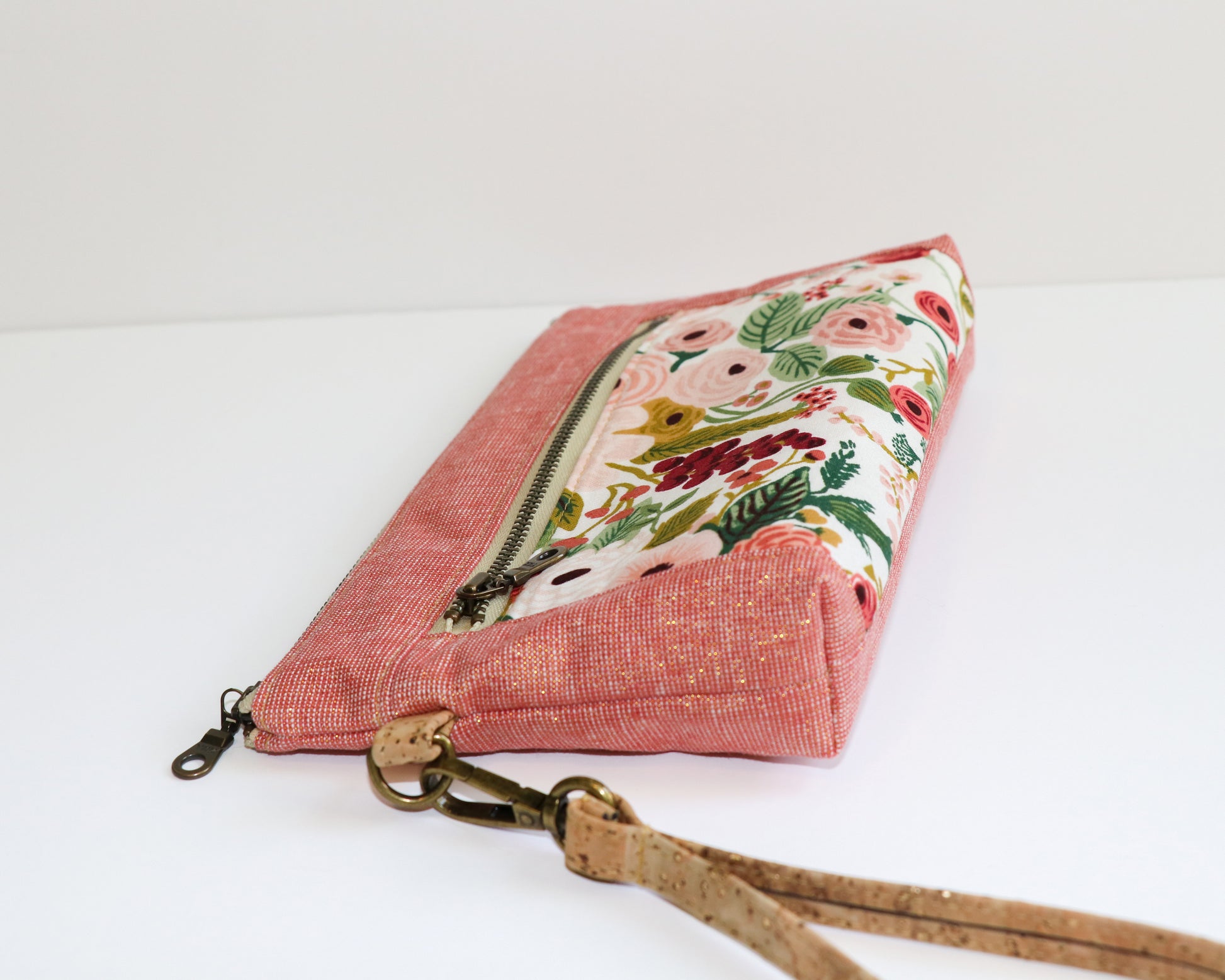 pink tones floral with dusty rose metallic linen wristlet, laying flat