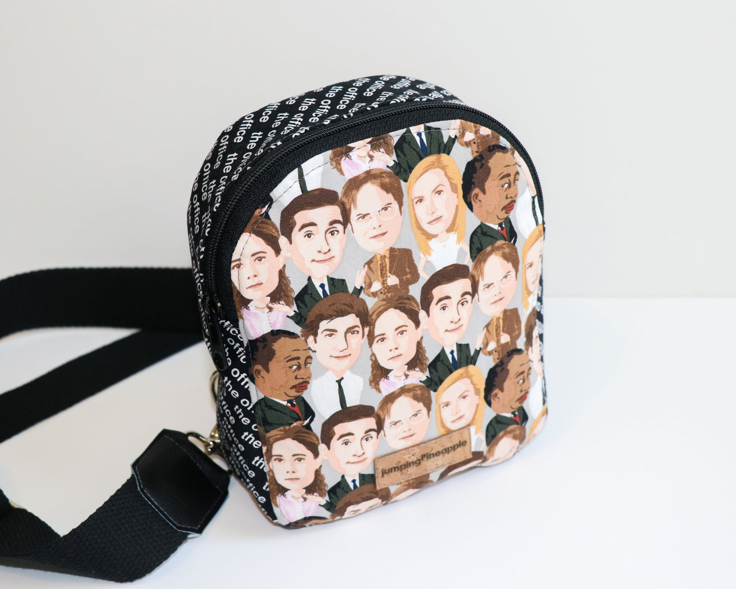 The Office characters mini backpack sling, front view