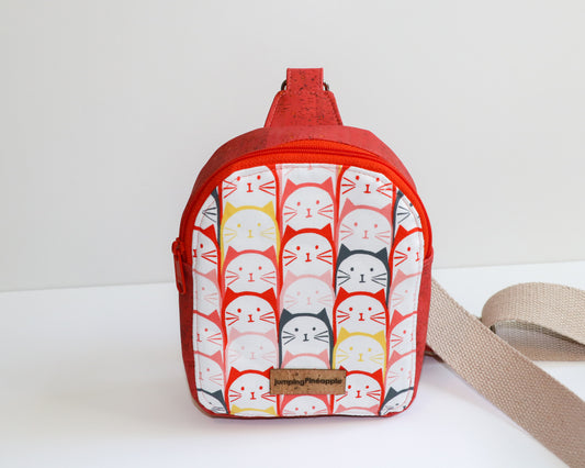 coral cats mini backpack sling, front view
