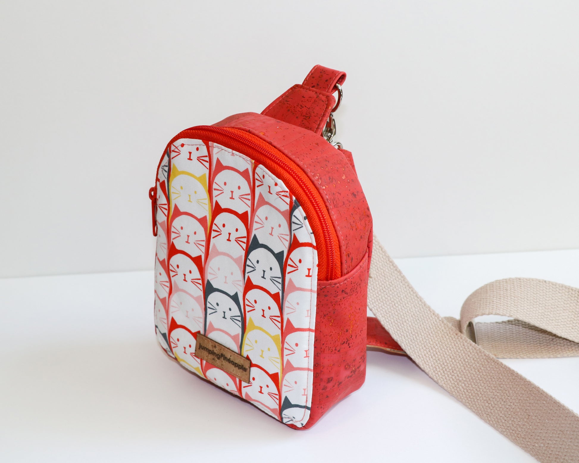 coral cats mini backpack sling, side view