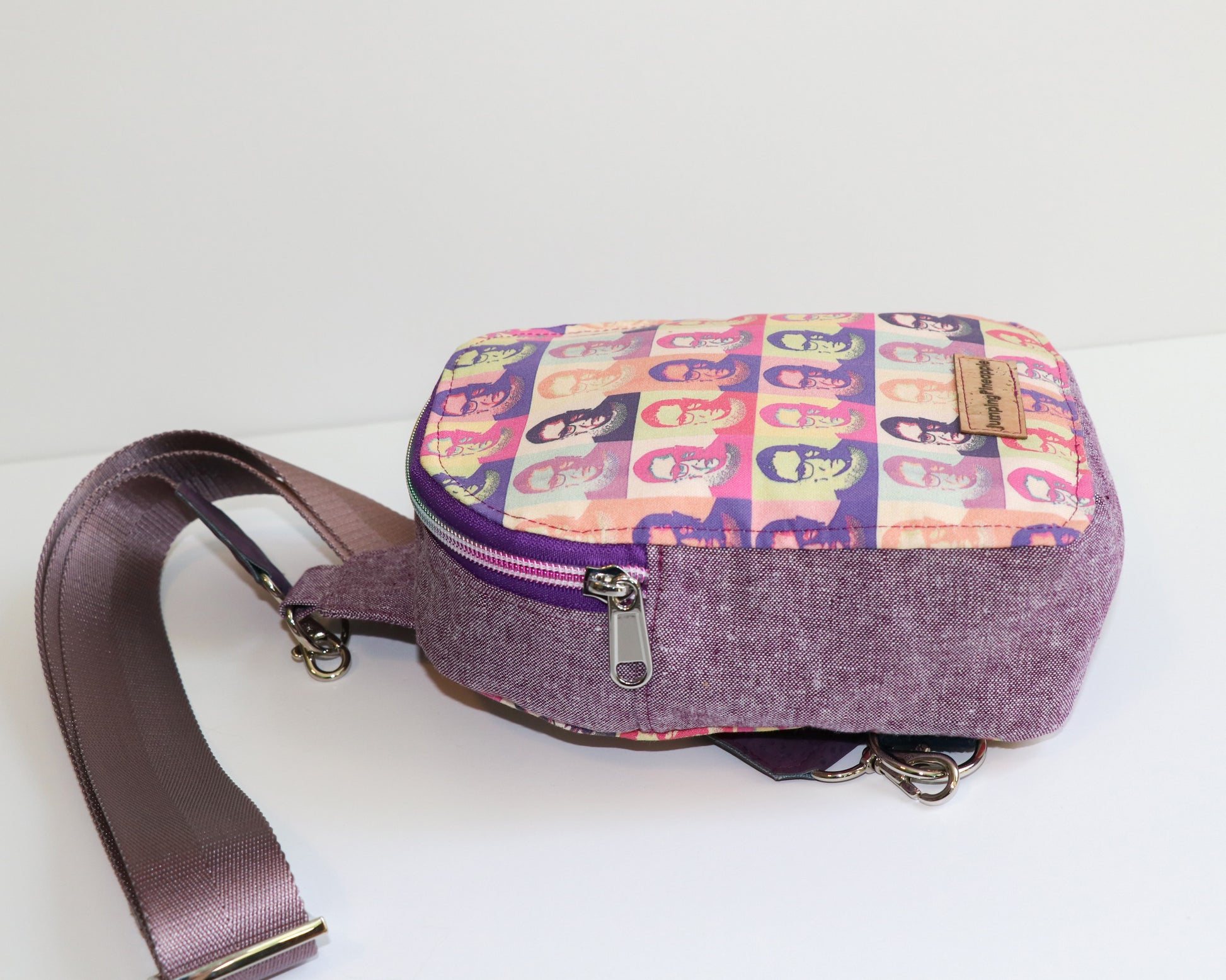RBG and purple linen mini backpack sling, laying flat