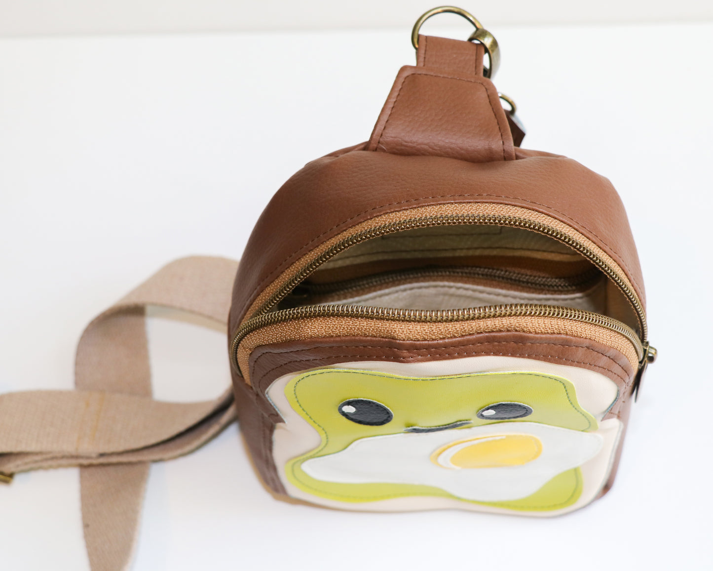 avocado toast mini backpack sling, top and inside view