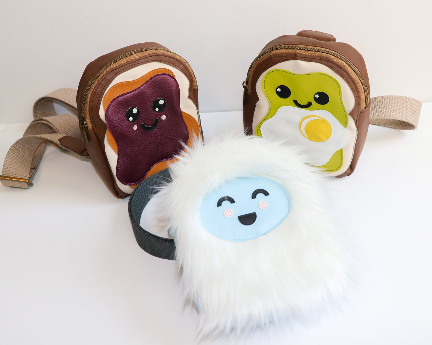 group of available animated mini backpack slings