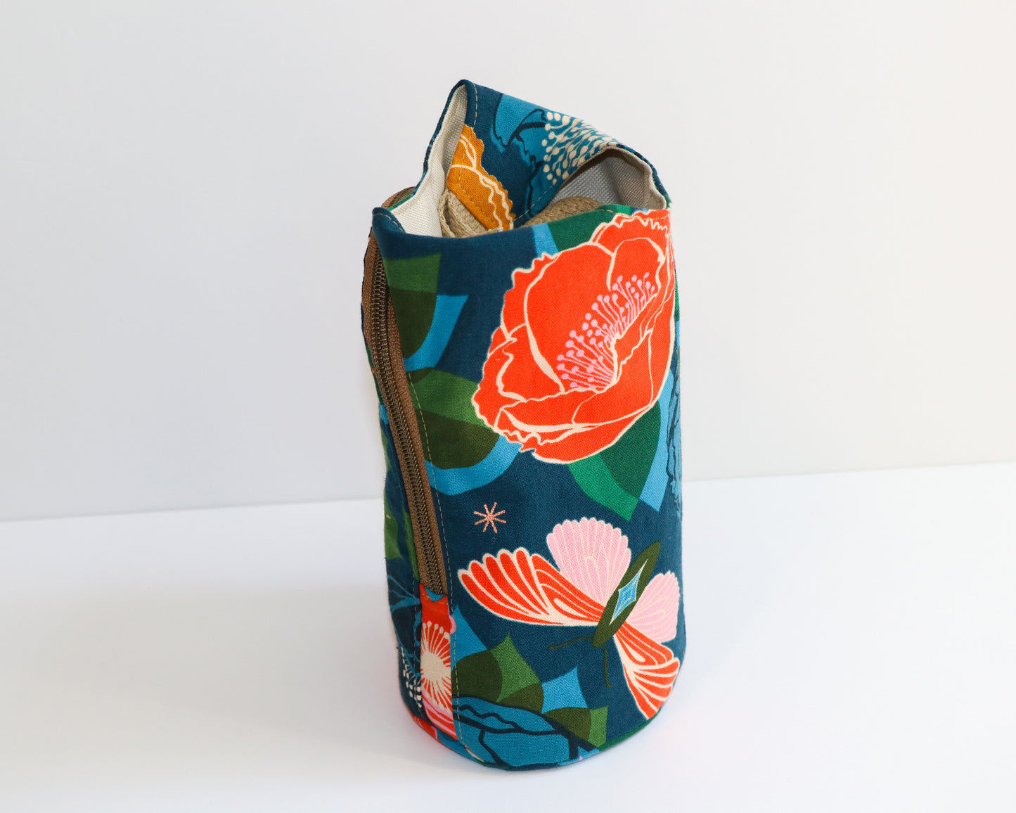 navy canvas with big vold floral print water bottle sling, side view
