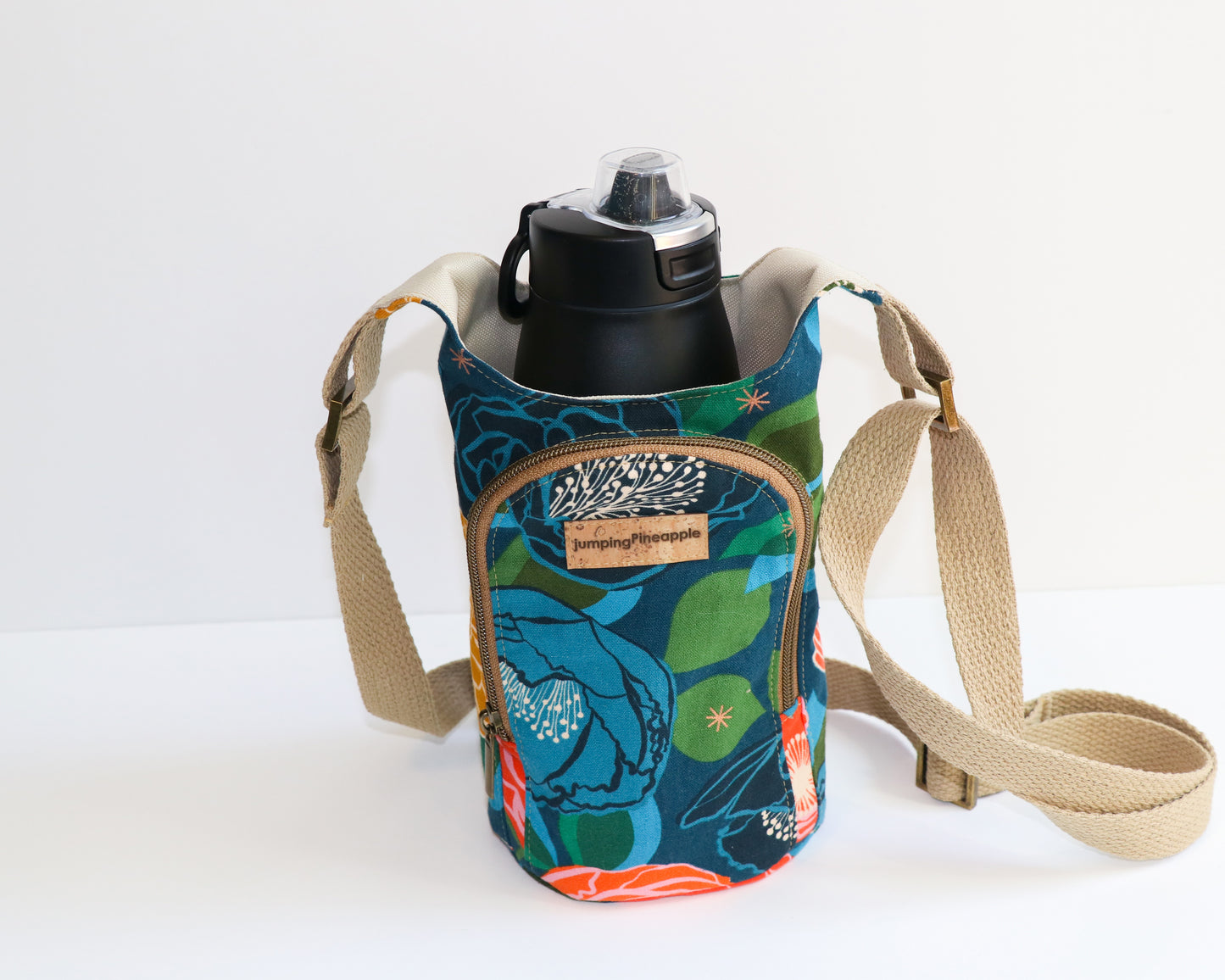 navy canvas with big vold floral print water bottle sling, front view with water bottle inside