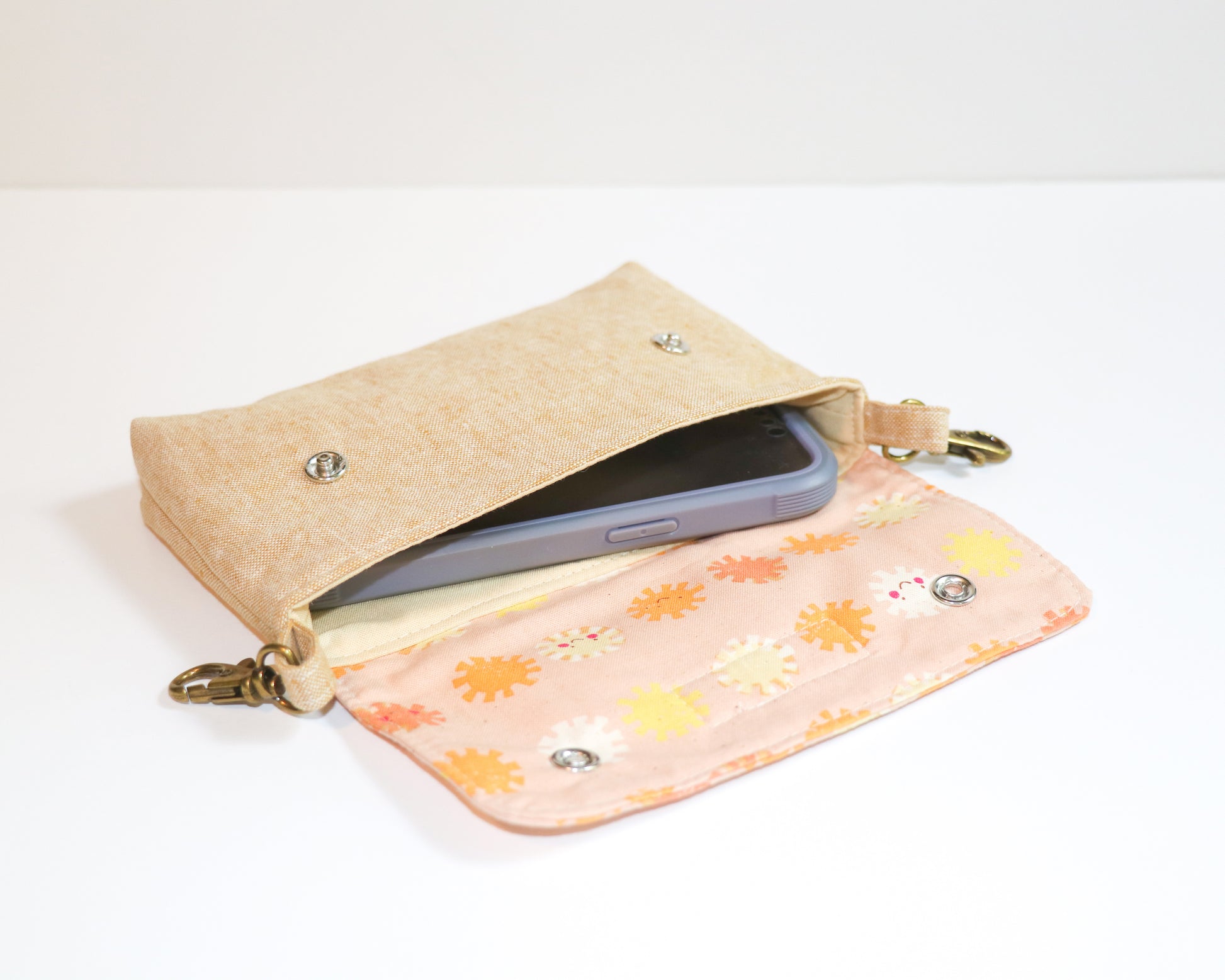 coral sunshine belt loop pouch, inside view with phone
