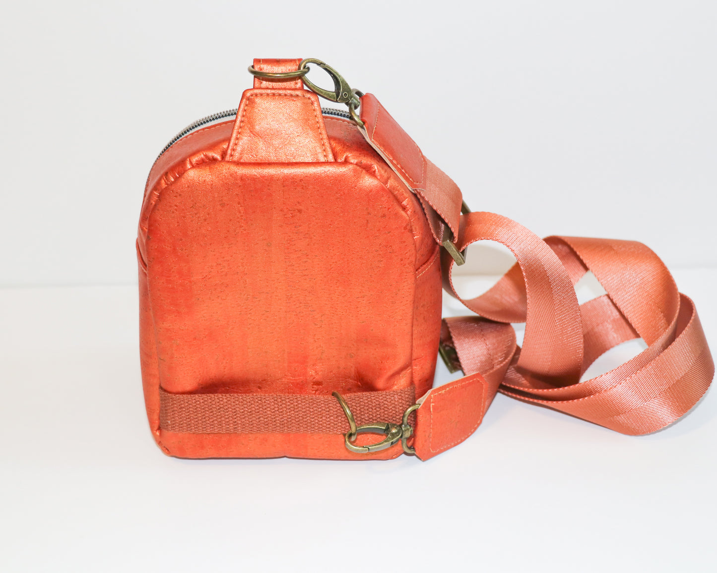 butterflies and shimmer orange cork mini backpack sling, back view