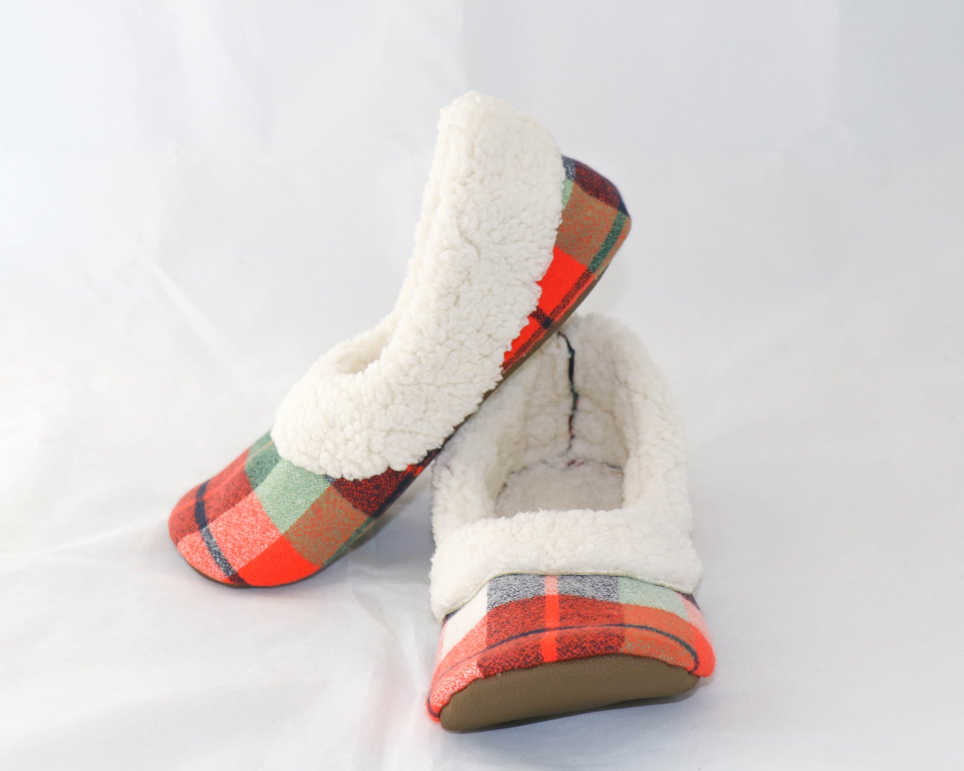 orange and green flannel slippers with cream sherpa inside