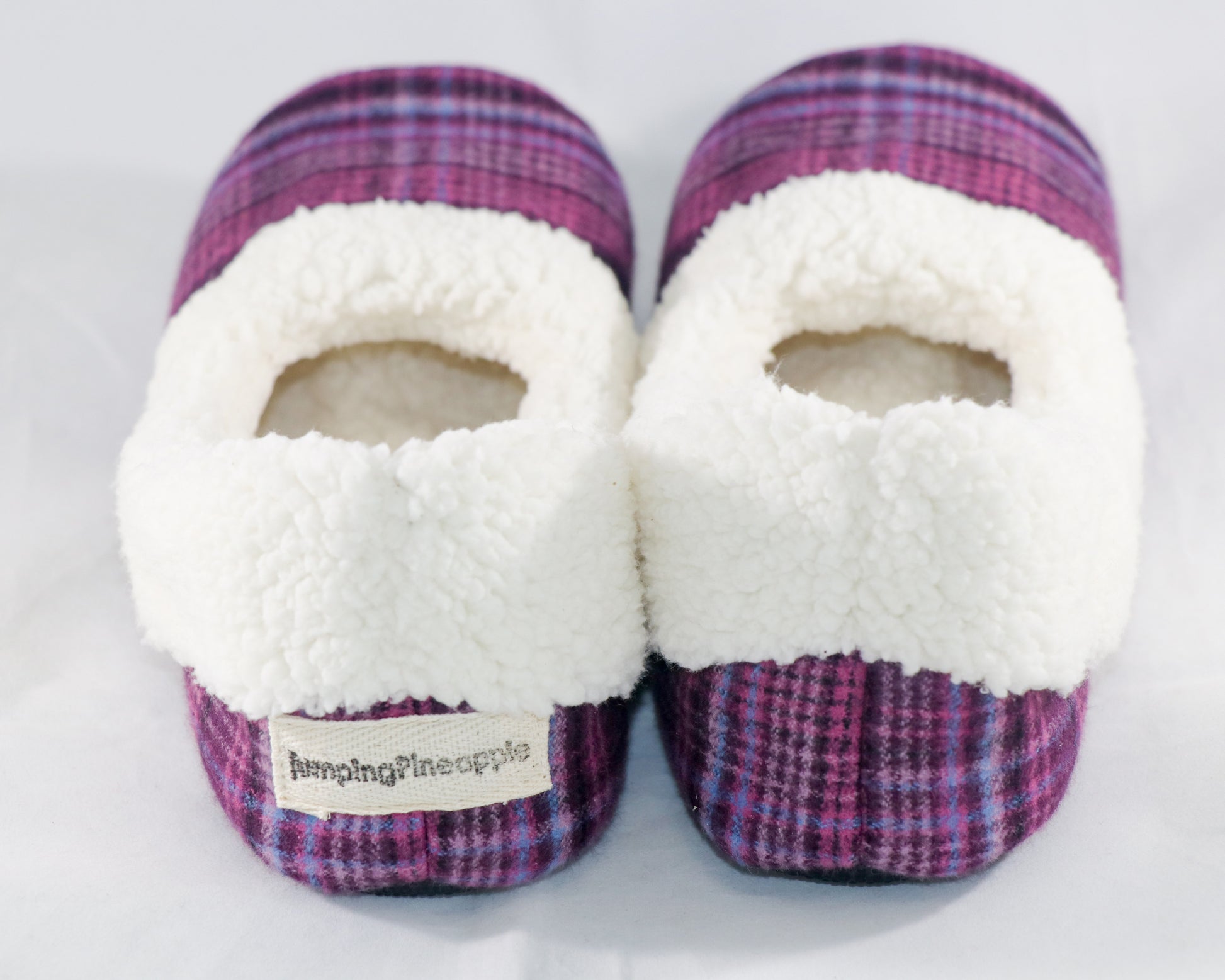 back view of magenta plaid flannel slippers with sherpa lining